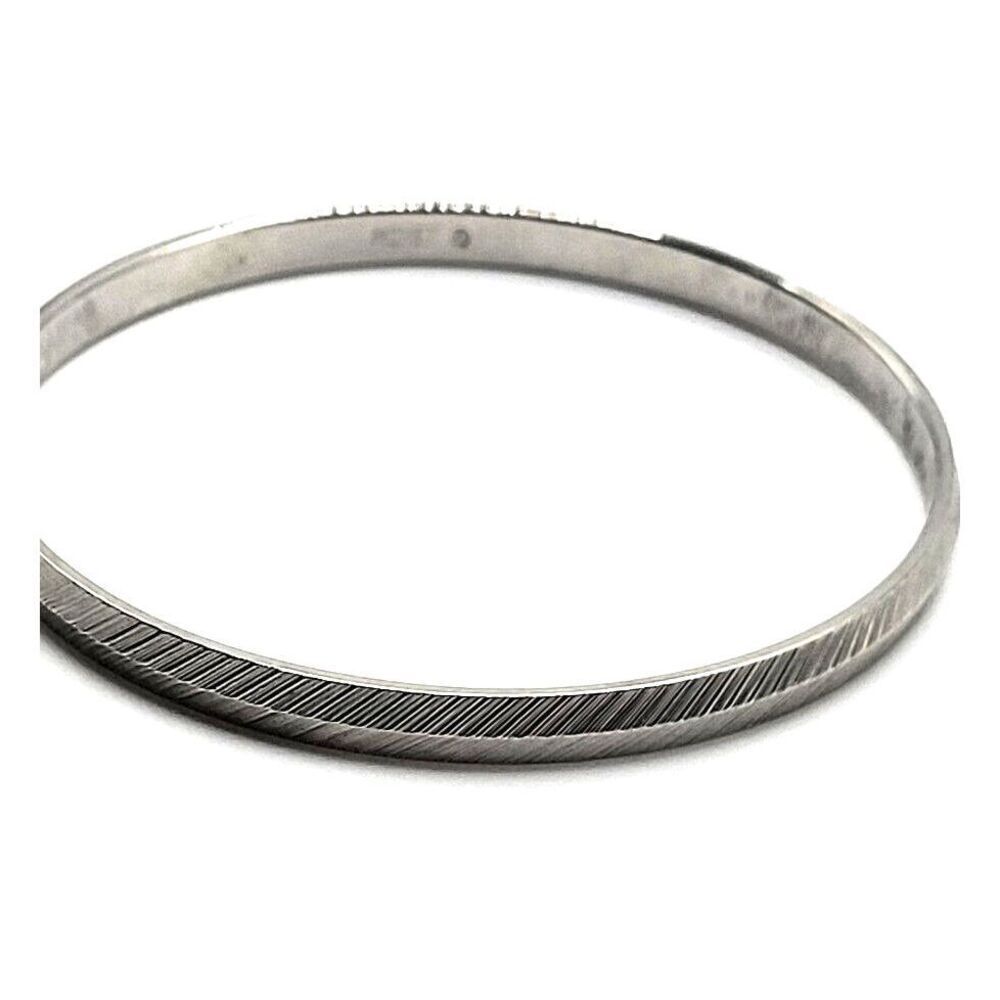 Monet Embossed Silver Metal Bangle Bracelet 7in